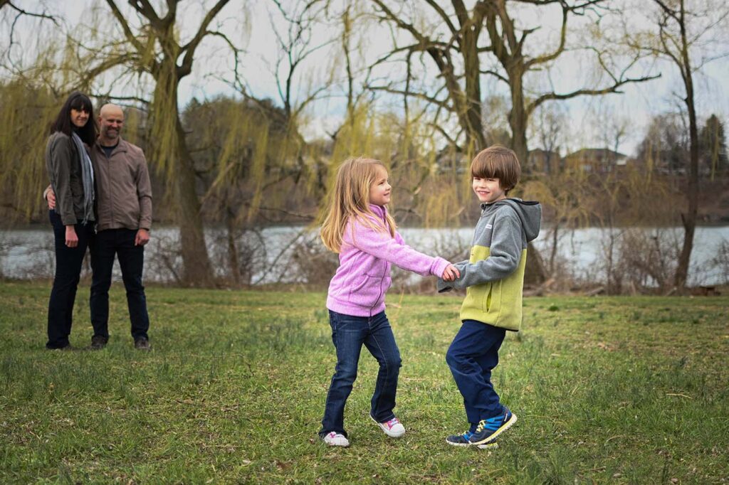 Two kids playing ring-around-the-rosie,