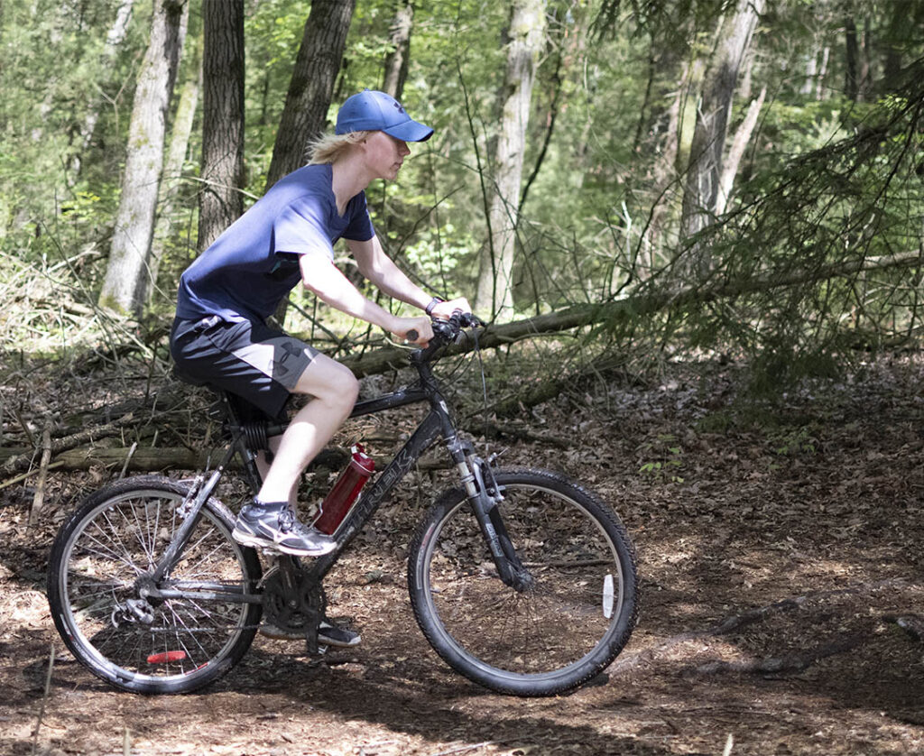 Boy on a bike, showing a faster shutter speed.